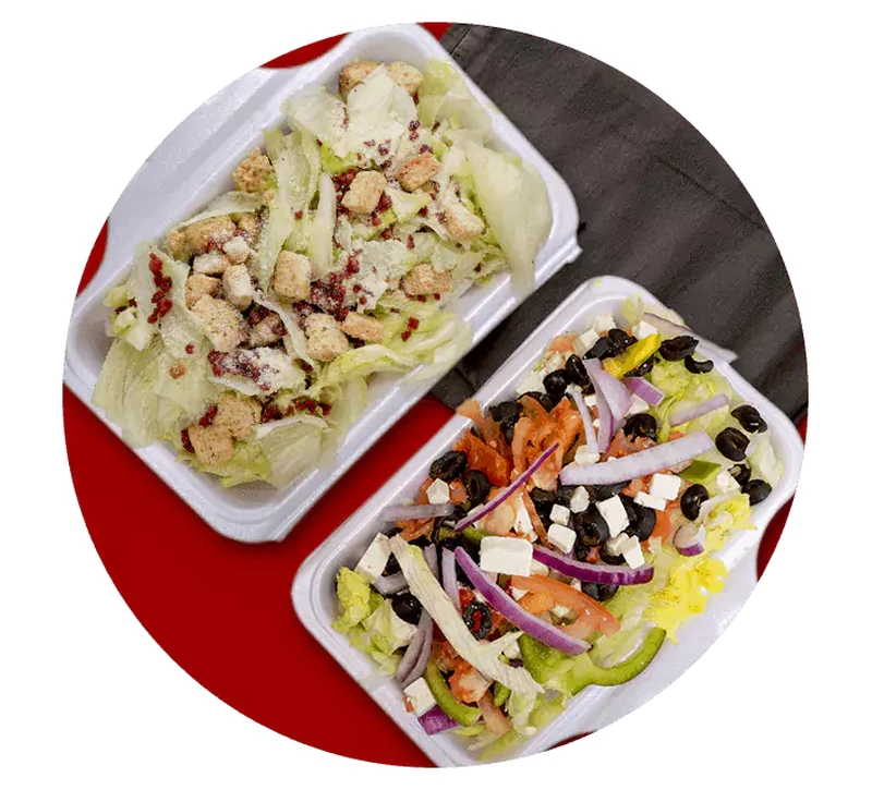Fresh Caesar and Greek salads at Queen's Pizza & Wings in Hamilton, ON